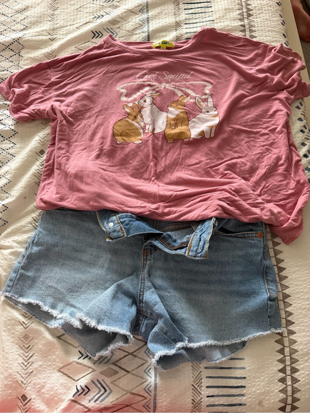 Girls' Pink Bunny Squad Short Sleeve Tee and Levi’s Jean shorts.